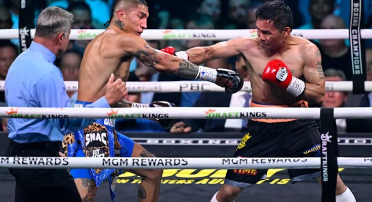 Las Vegas, Nevada - július 19 .: Manny Pacquiao (fekete rövid) és Mario Barrios (kék rövid) ütéseket cserél a WBC Welterweight bajnokság bajnoki bajnokságán, az első boksz -bajnokságtól, az Egyesült Államok, 2025. július 19 -én.