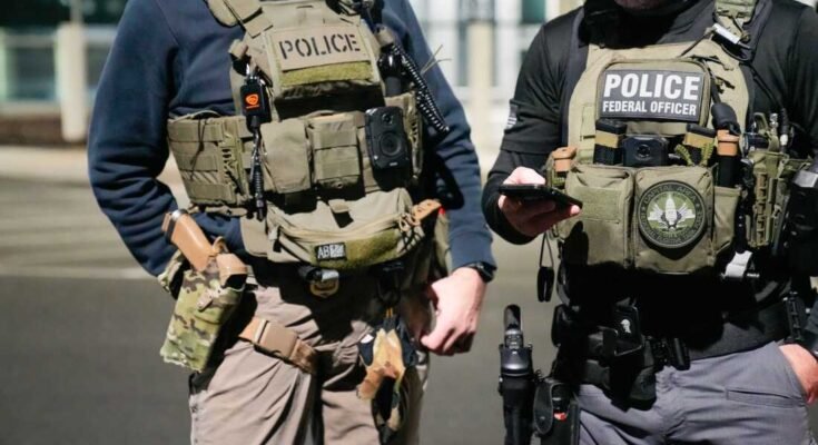In this document photo provided by the immigration forces and American customs, two federal law enforcement agents coordinate with other officials during an official of February 4, 2025 near Washington, DC (photo of American immigration and customs application via Getty images))))))